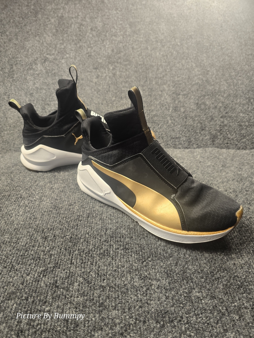 Stylish Puma Black and Gold Slip-On Sneakers Size 8.